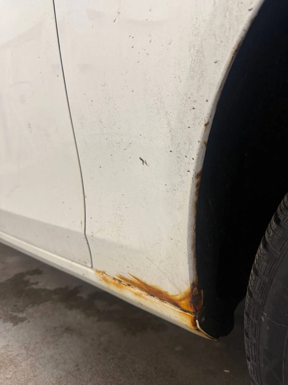 Vehicle panel before rust repair